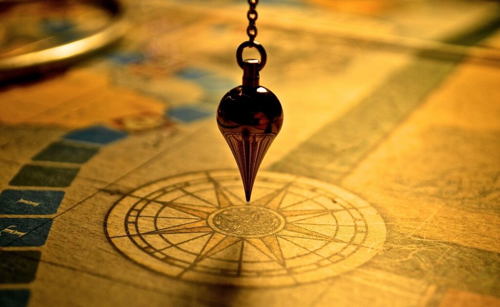 Pendulum over antique map symbolizing strategic user journey planning.